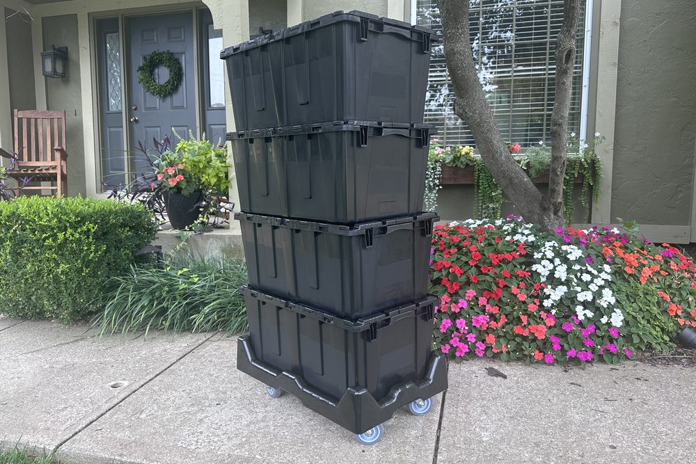 JoCo Bin Co moving bins stacked on a dolly outside an Overland Park home