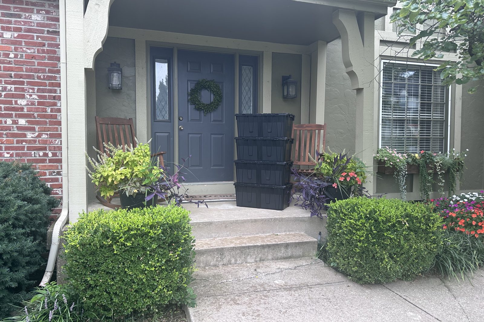 JoCo Bin Co moving bins stacked at the front door of an Overland Park home on delivery day